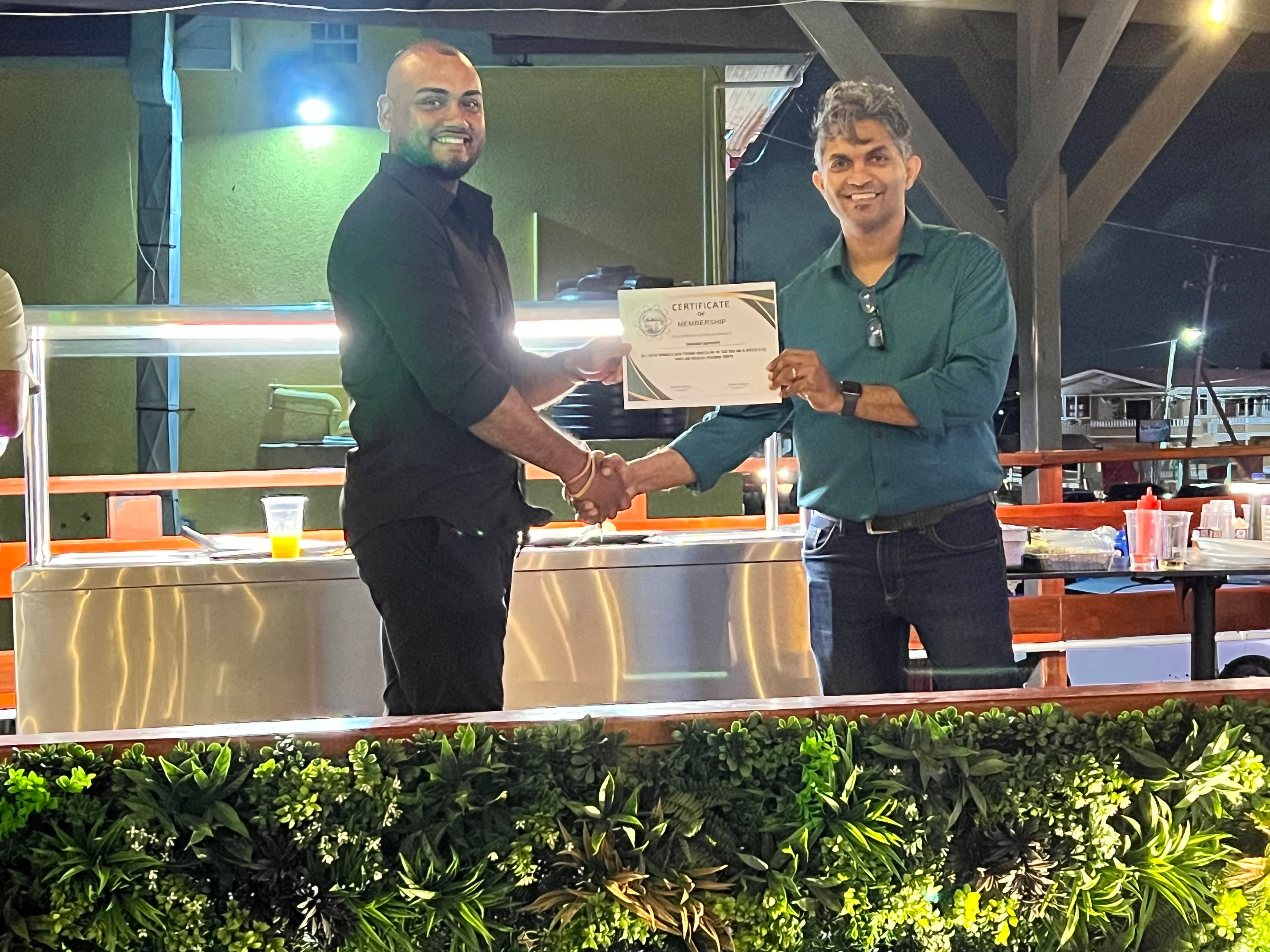 Awarding Membership Certificate to Shemakiah Supercenter